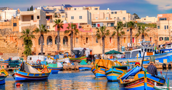 Marsaxlokk village port of Malta, illuminate by sunset light, Eu Marsaxlokk village port of Malta, illuminate by sunset light, European travel in beautiful place
